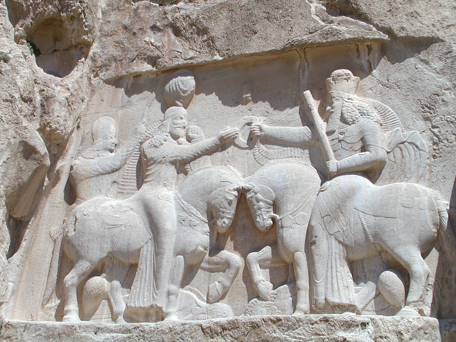 Ardašīr Crowned by Mazdā — At Naqsh-e Rostam, Ahura Mazda hands the ring of kingship to the founder of the Sasanian fire.