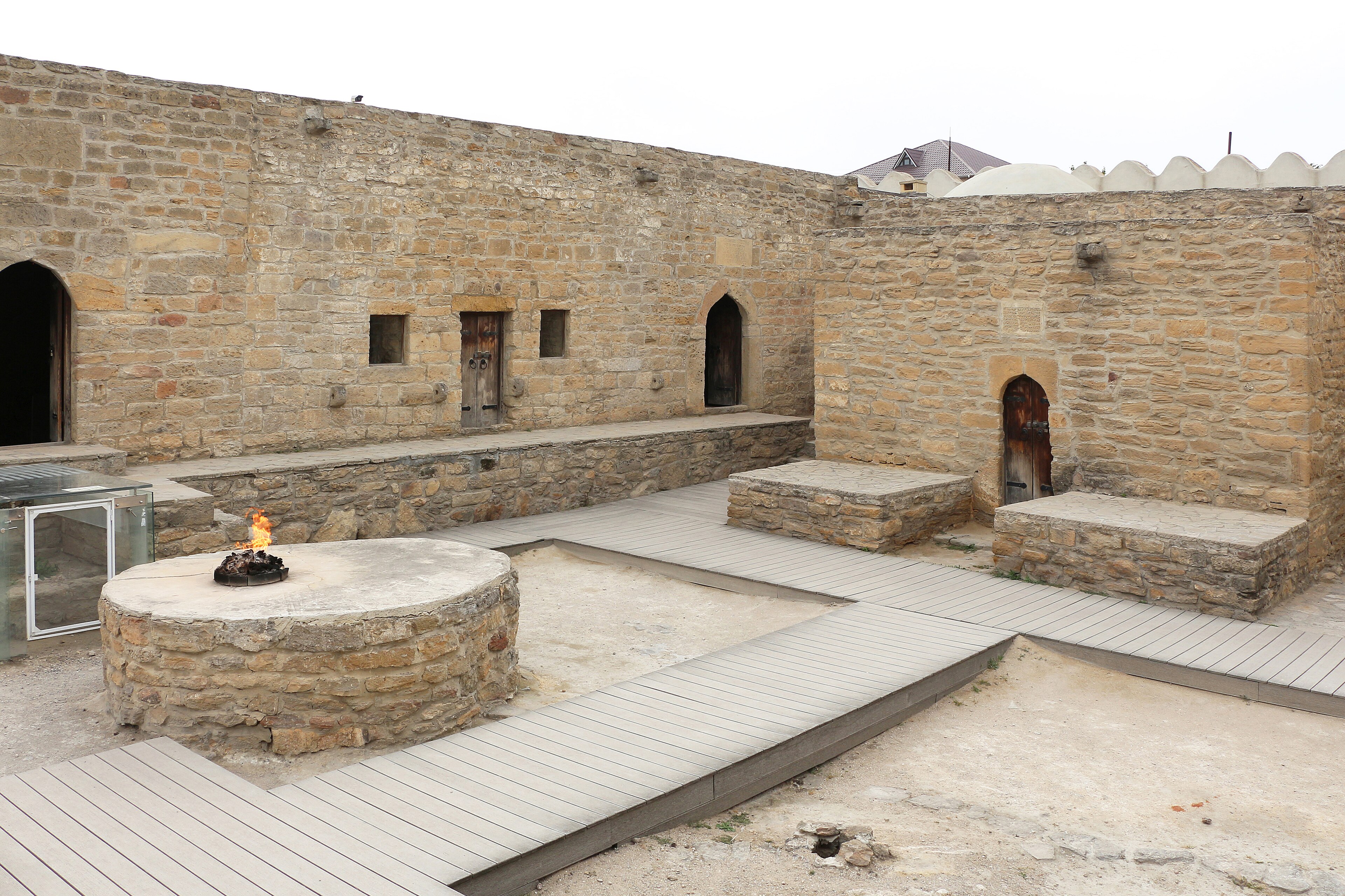 The Ateshgah of Baku — The pentagonal fire-temple fed by a vent of natural flame, where Iran and India met at the fire.
