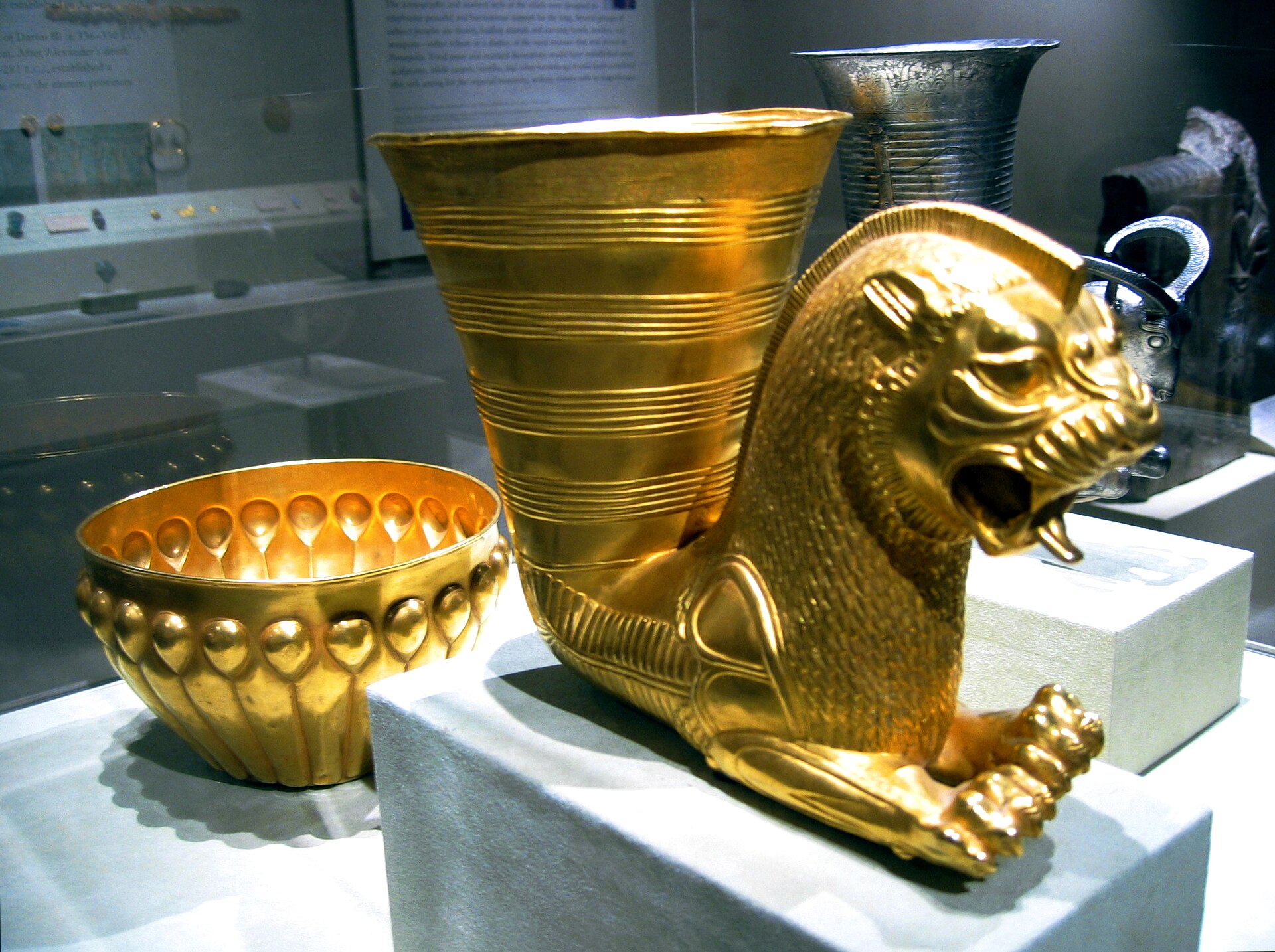 The Horn-Vessels — The rhyta of the Persian table, poured from the mouth of lion and griffin.