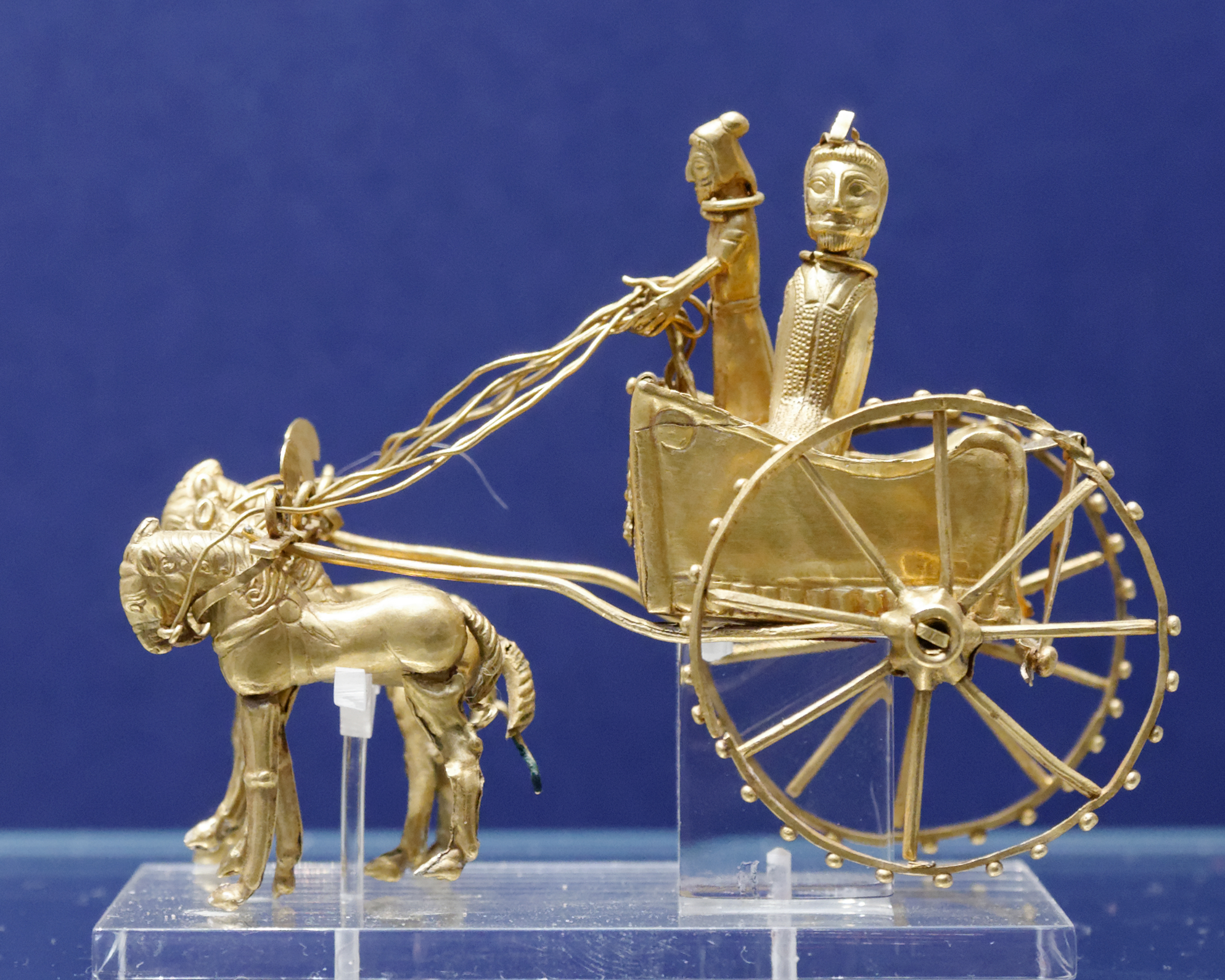 The Oxus Chariot — The miniature gold chariot of the Oxus Treasure, drawn by four horses across two and a half millennia.