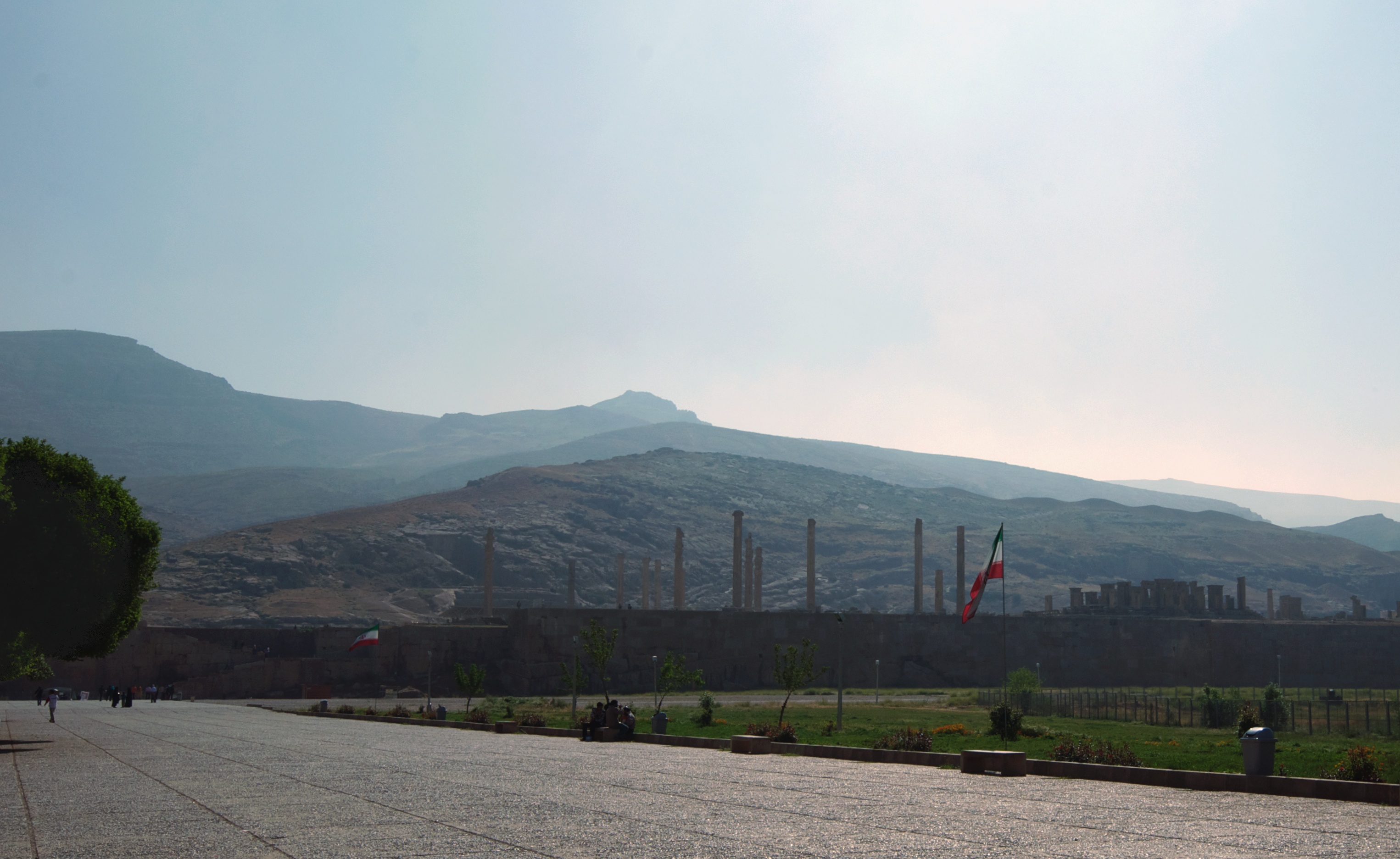 Approaching Persepolis — The road to the terrace of the King of Kings, the columns rising from the plain of Marv Dasht.