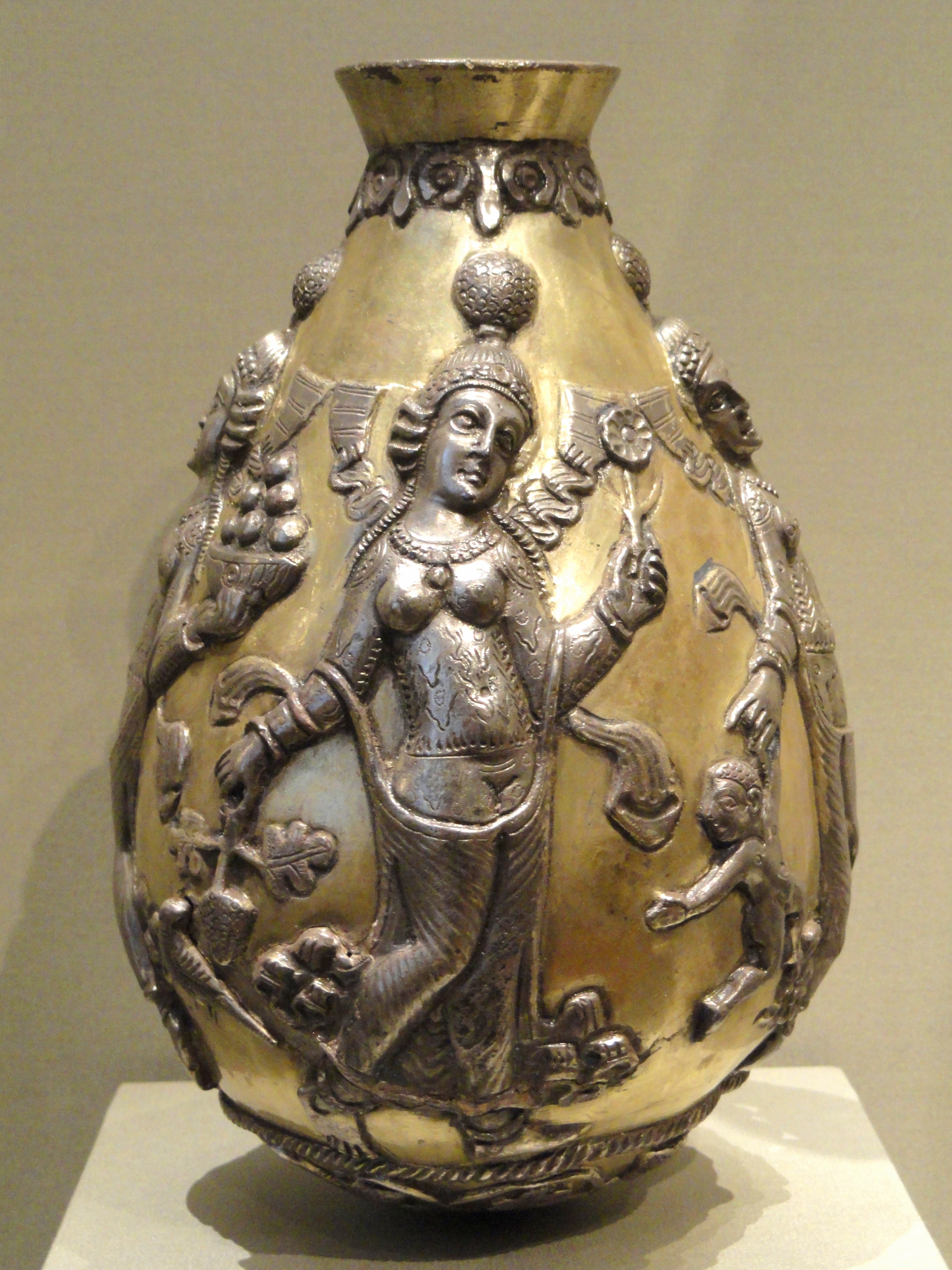 The Anāhitā Ewer — A Sasanian silver-gilt vessel, the goddess of the waters worked into the metal.