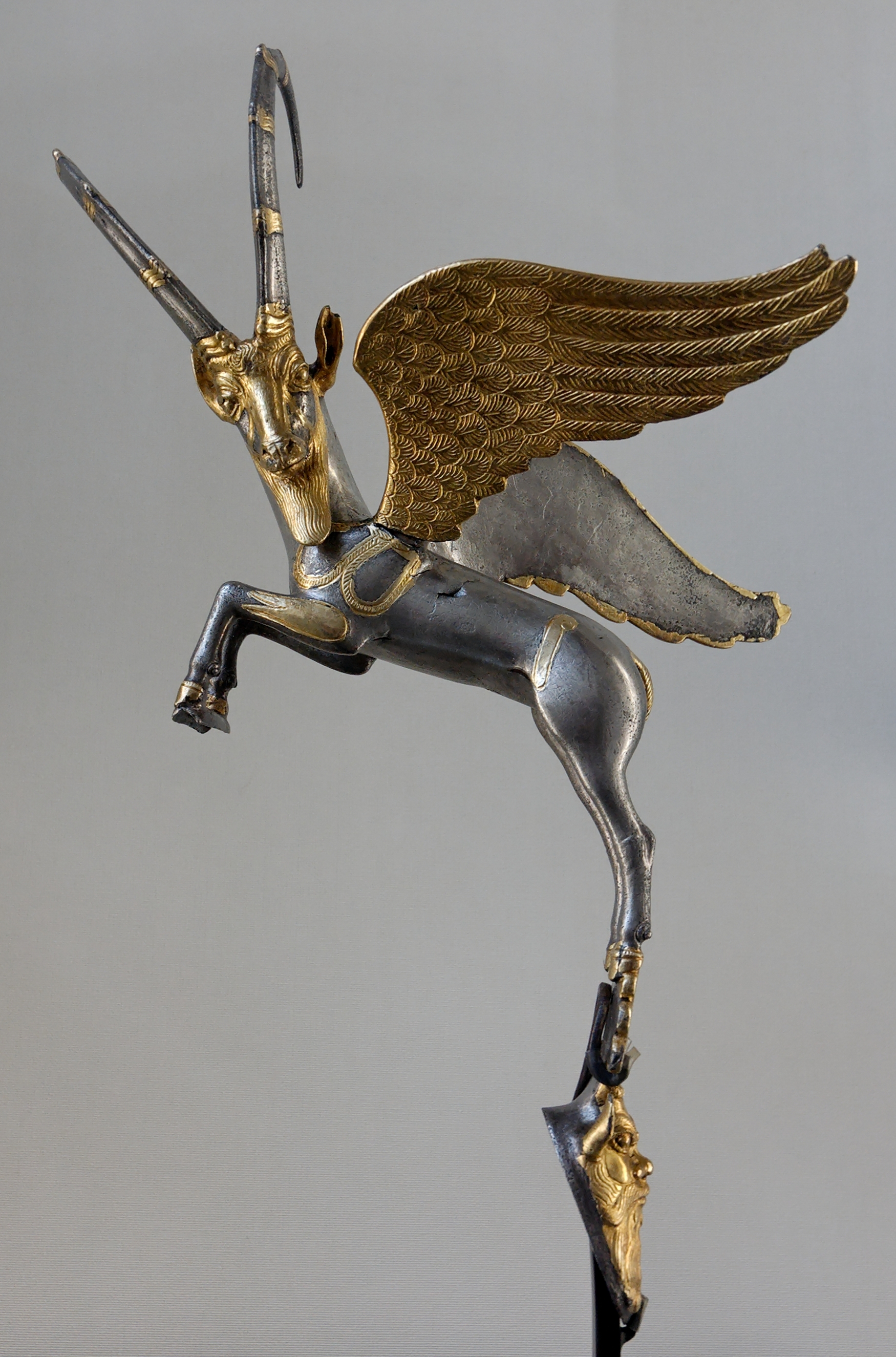 The Winged Ibex — The silver-and-gold vase handle of a leaping ibex — Achaemenid metalwork at its summit.